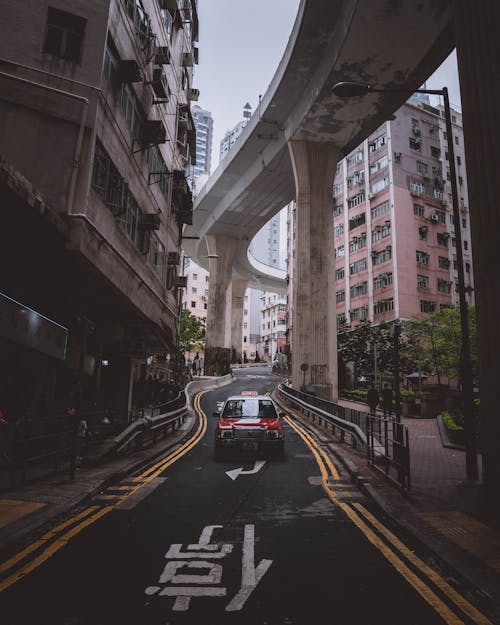 Photo Of Red Vehicle On Road