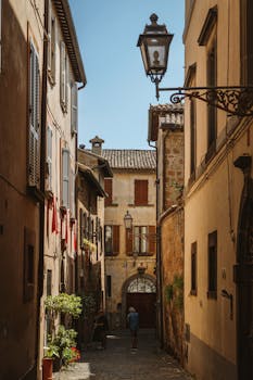 Explore a picturesque alley in Orvieto, Umbria with classic Italian architecture.