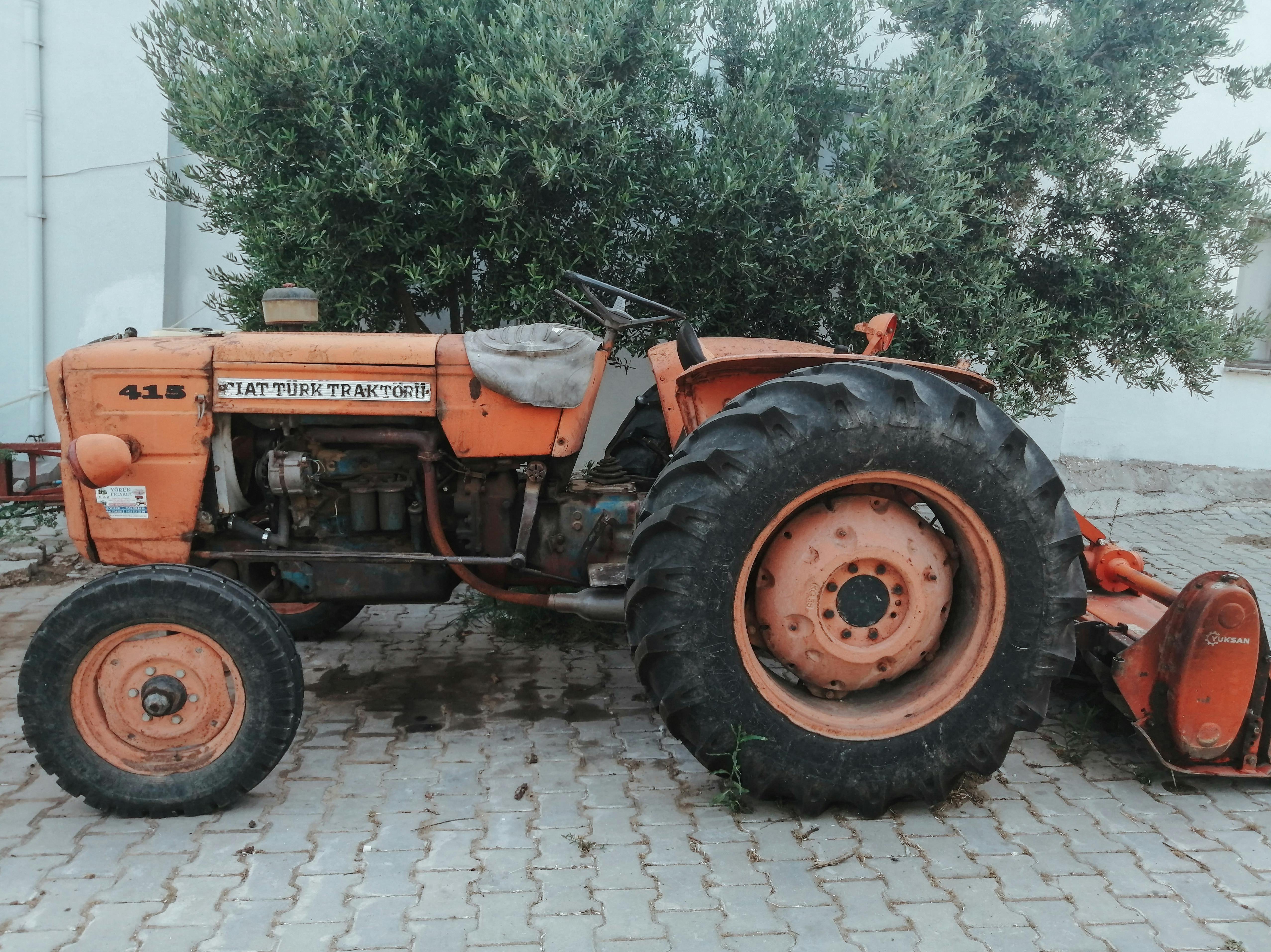 Classic orange tractor parked outdoors in Tekirdağ, Türkiye, showcasing rustic agricultural machinery.