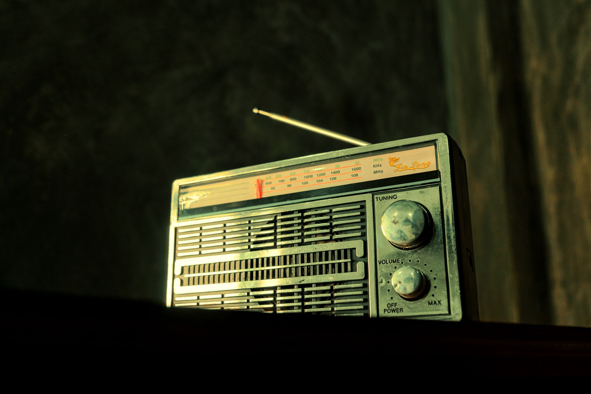 A nostalgic vintage radio with visible tuning dial, evoking classic charm.