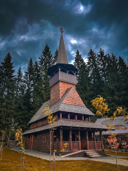 Free A beautiful Orthodox Church located in Bukovel, Ukraine — surrounded by the scenic Carpathian Mountains. This wooden church showcases traditional Ukrainian architecture and serves as a pea... Stock Photo