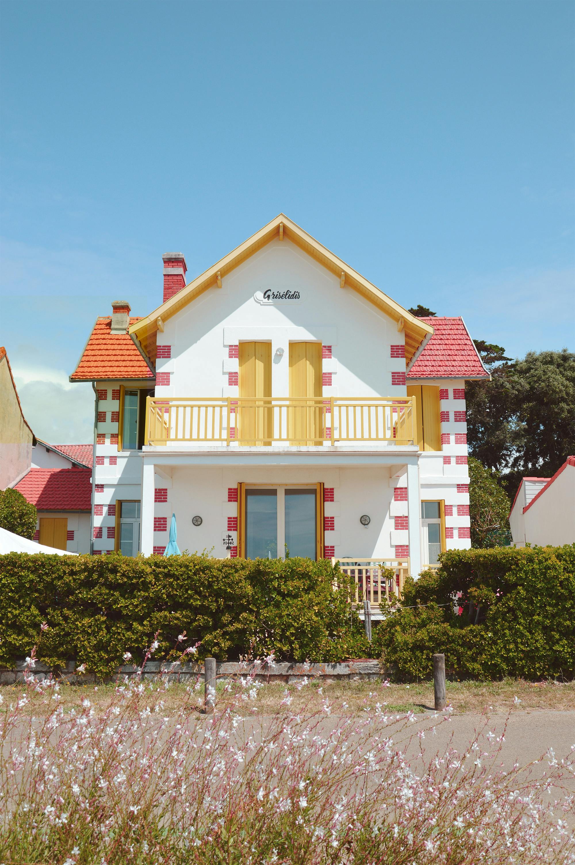 Bright coastal house with colorful accents in Saint-Palais-sur-Mer, France.