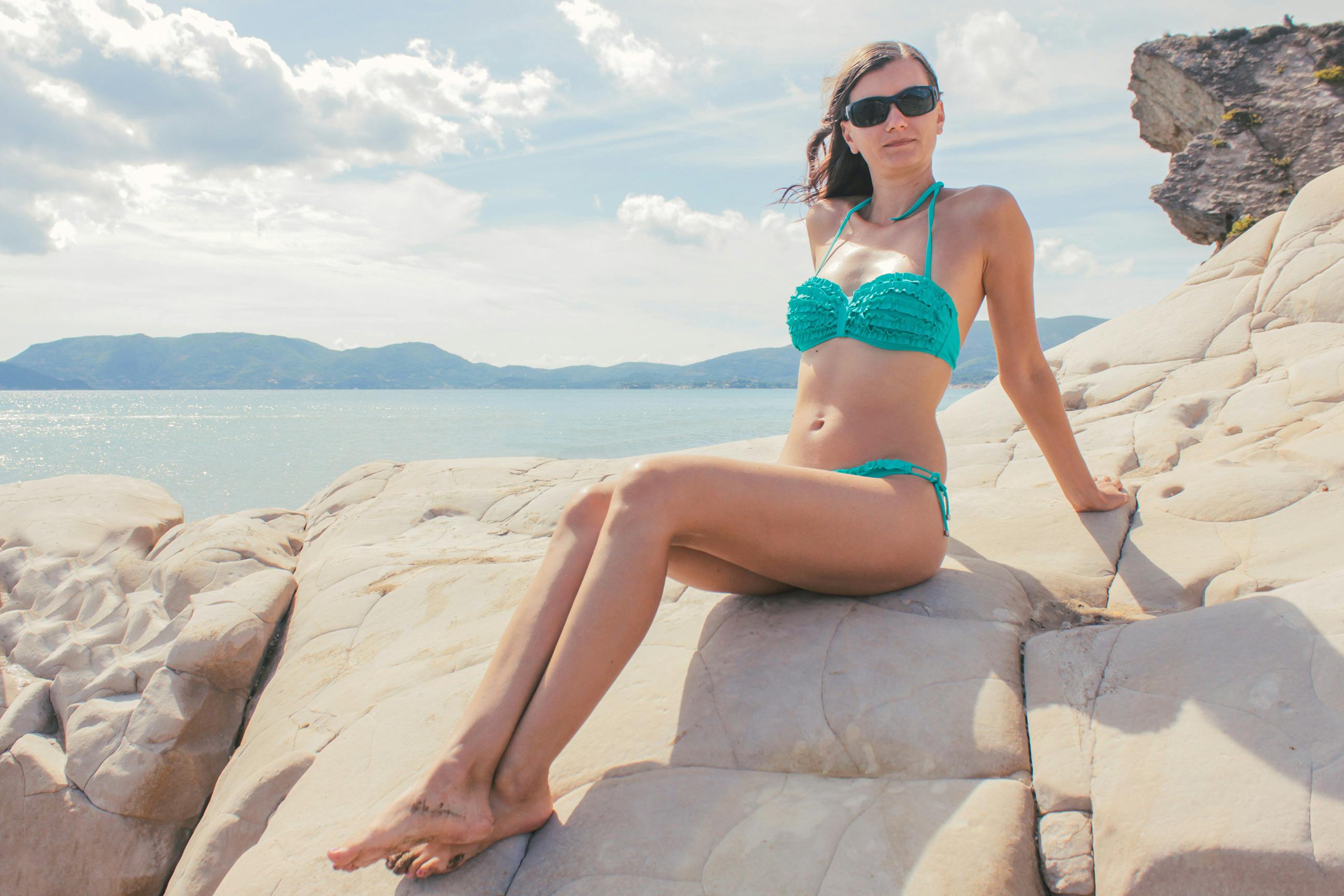 Woman Lying in Seashore · Free Stock Photo