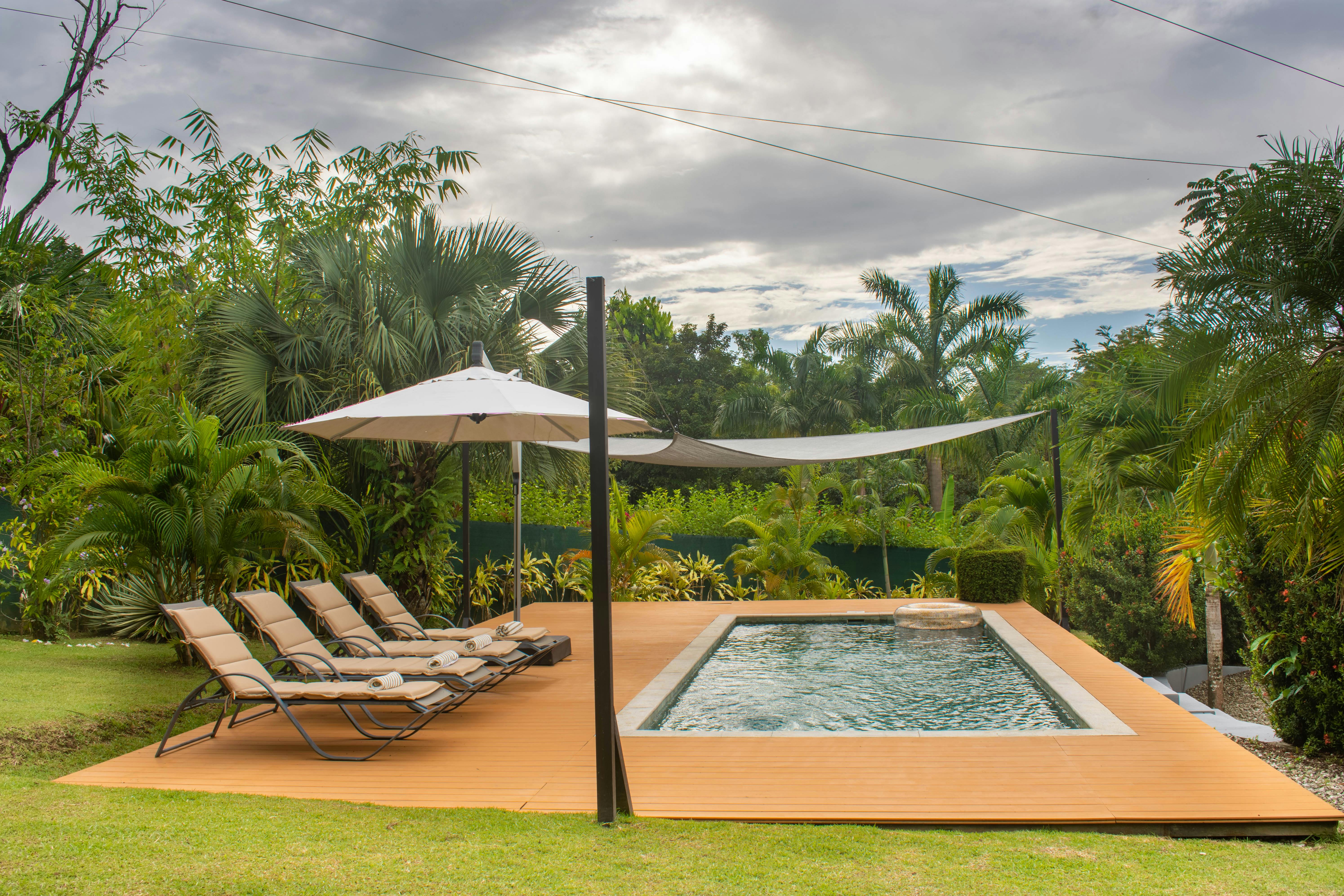 beautiful, completed backyard with a custom pool - cost of a pool liner above ground