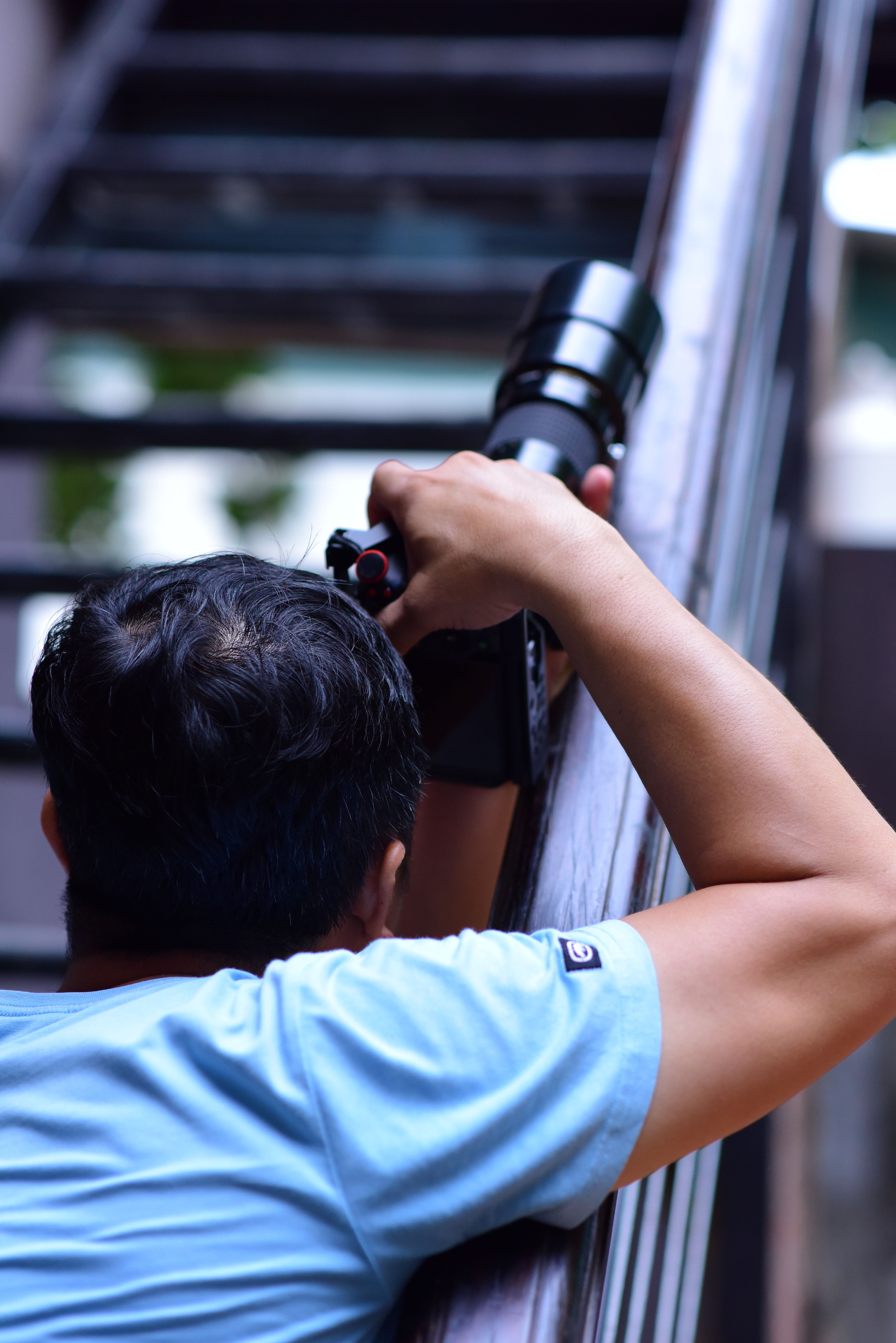 Professional Photographer Capturing Urban Scene · Free Stock Photo