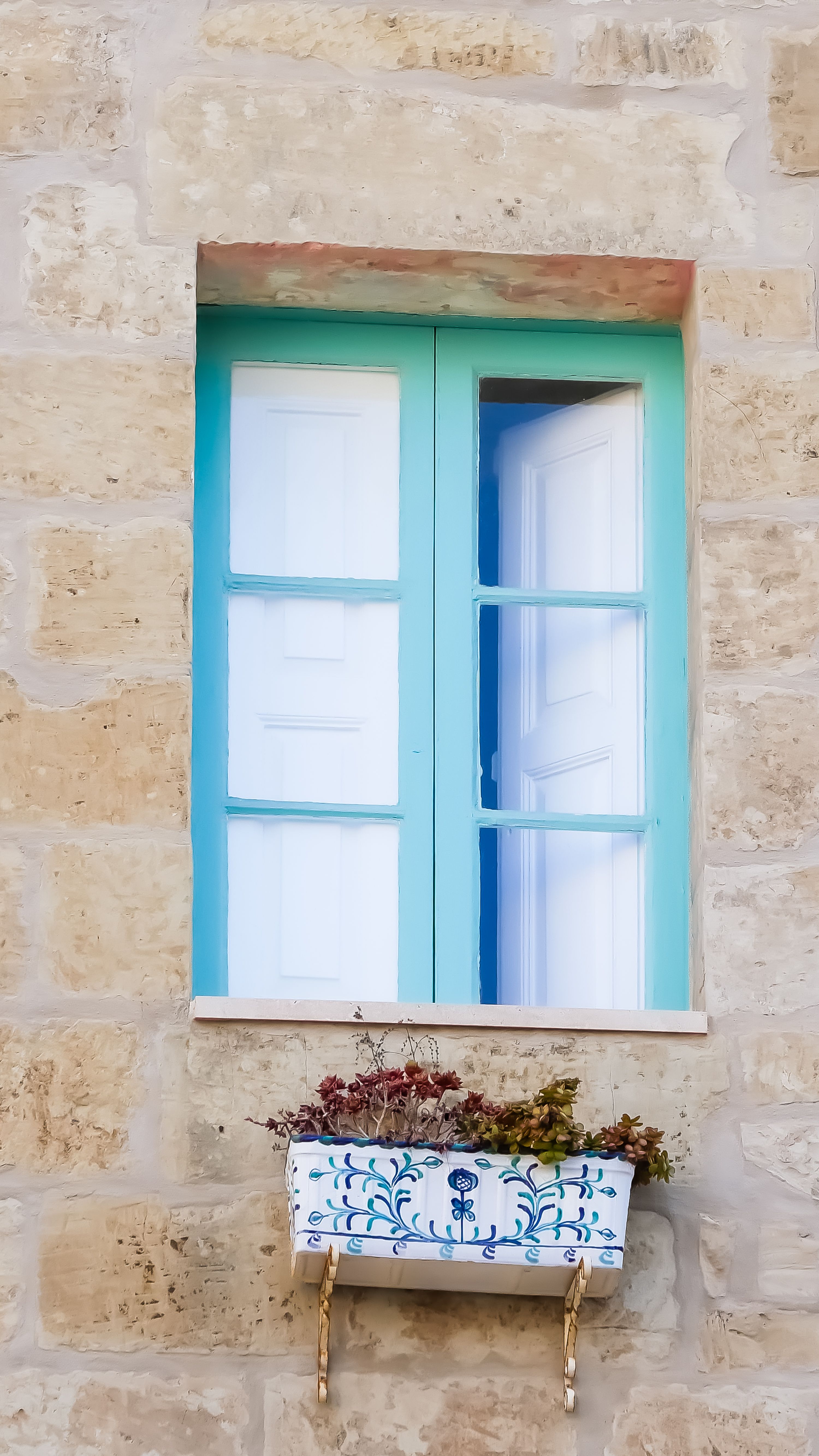 Charming Mediterranean Window with Floral Decor · Free Stock Photo