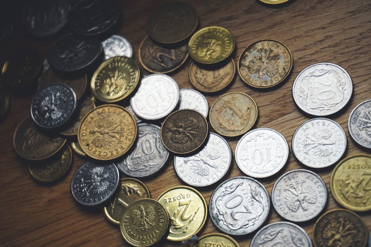 Close-up Of Coins On Table