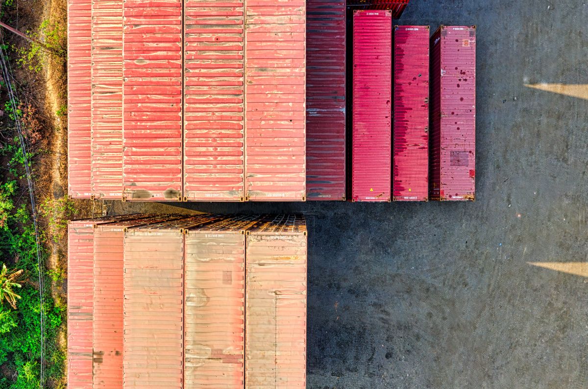 Top-down view of colorful cargo containers in an industrial area, Jakarta.