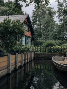 Quaint rustic house by a serene canal in Lübbenau, Brandenburg, Germany.