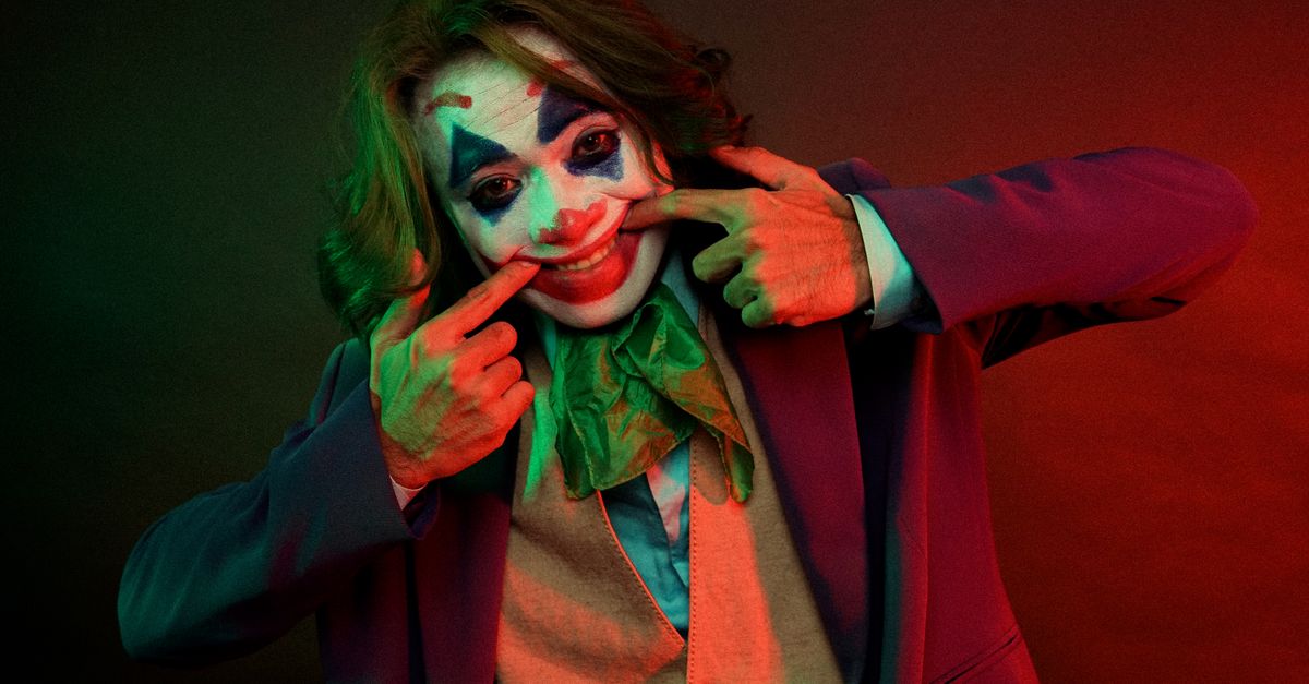 Summer 2026 Anime Season Unfolds with Crunchyroll Dub Debuts, One Piece Elbaph Arc, Joker Anime, and Minky Momo Return Dramatic male clown with painted face grimacing smile pulling mouth with hands while looking at camera