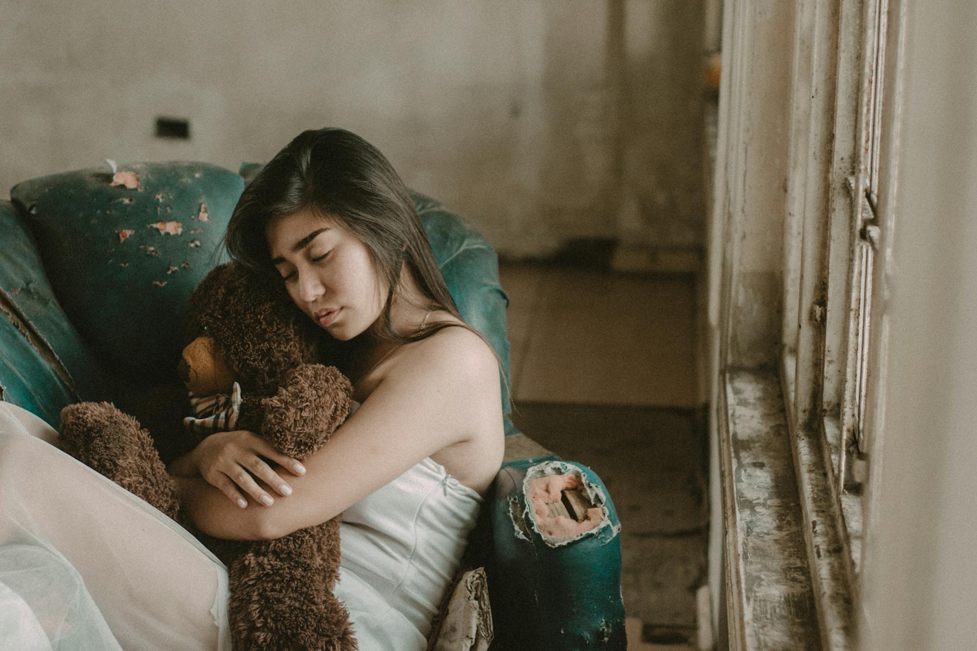Woman Hugging A Teddy Bear