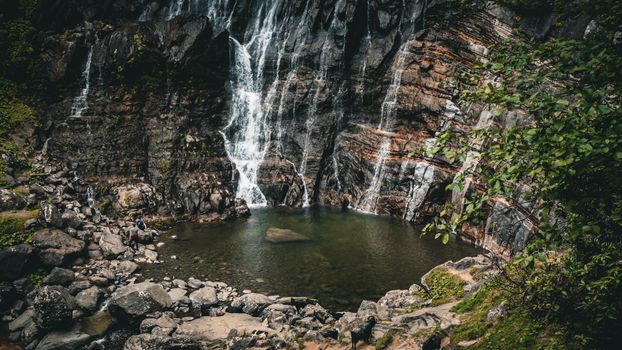 A breathtaking view of a waterfall cascading into a serene pool in Artvin, Türkiye.