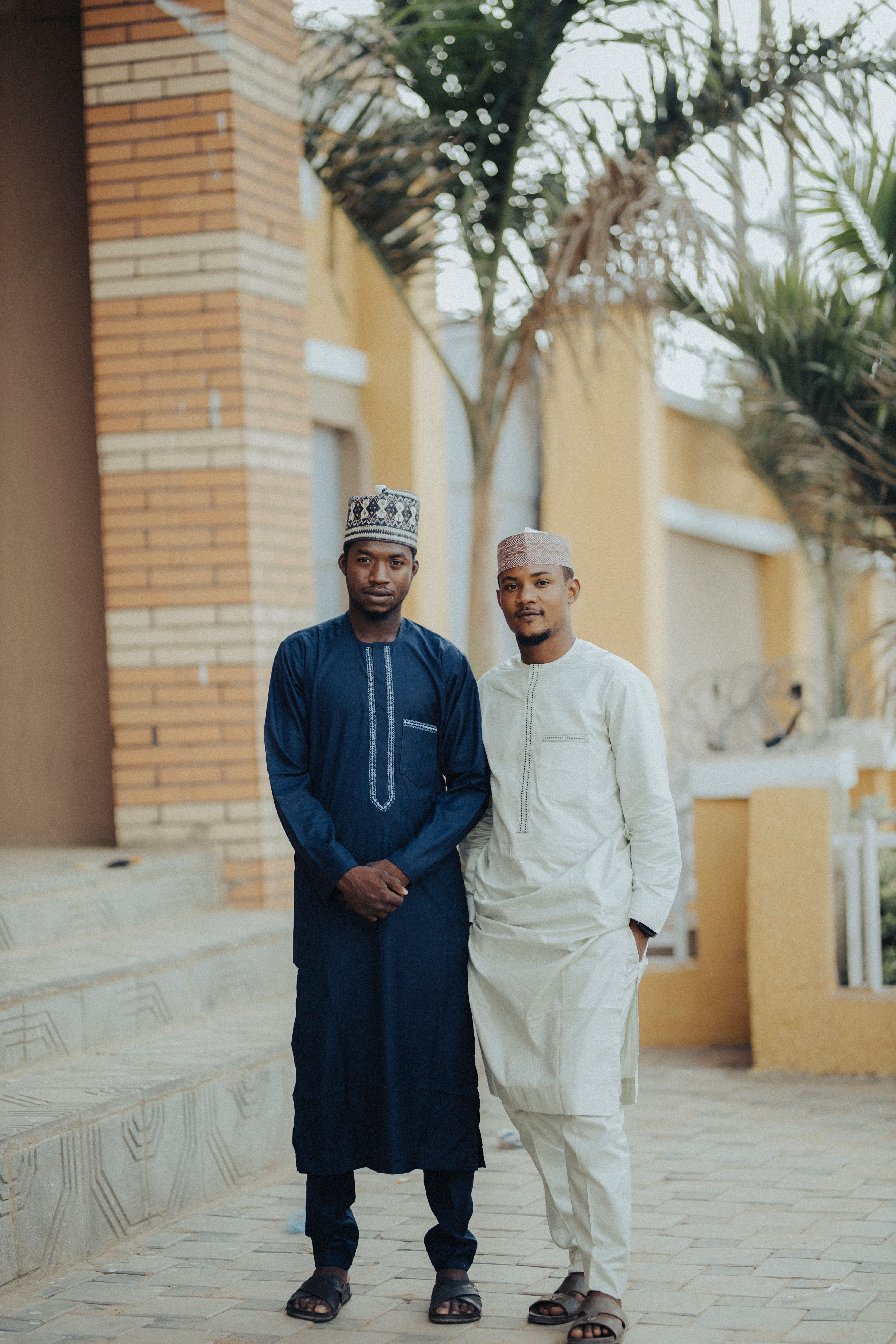 Two Men in Traditional Attire Outdoors · Free Stock Photo
