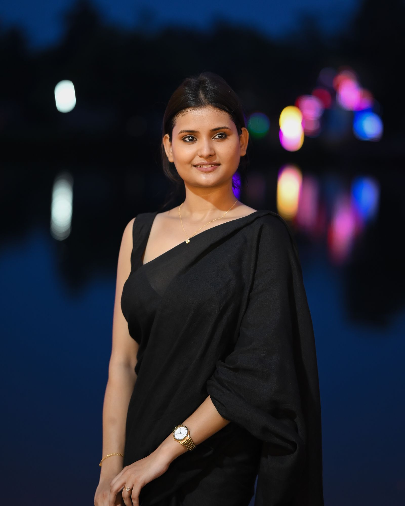 Woman in black evening saree