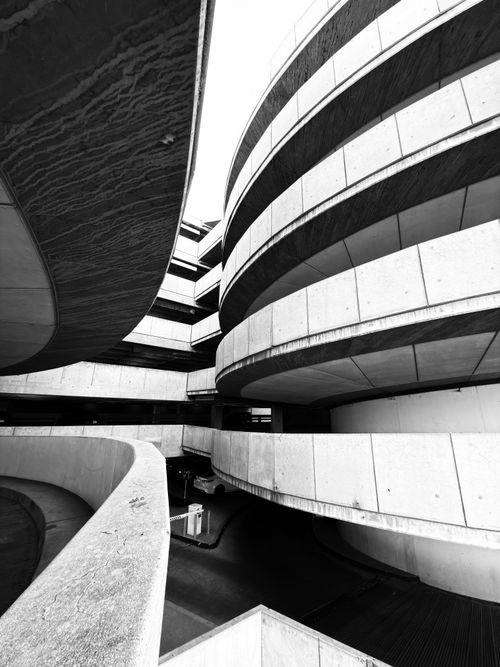 Free Black and white photo of curved modern architecture with abstract geometric forms. Stock Photo