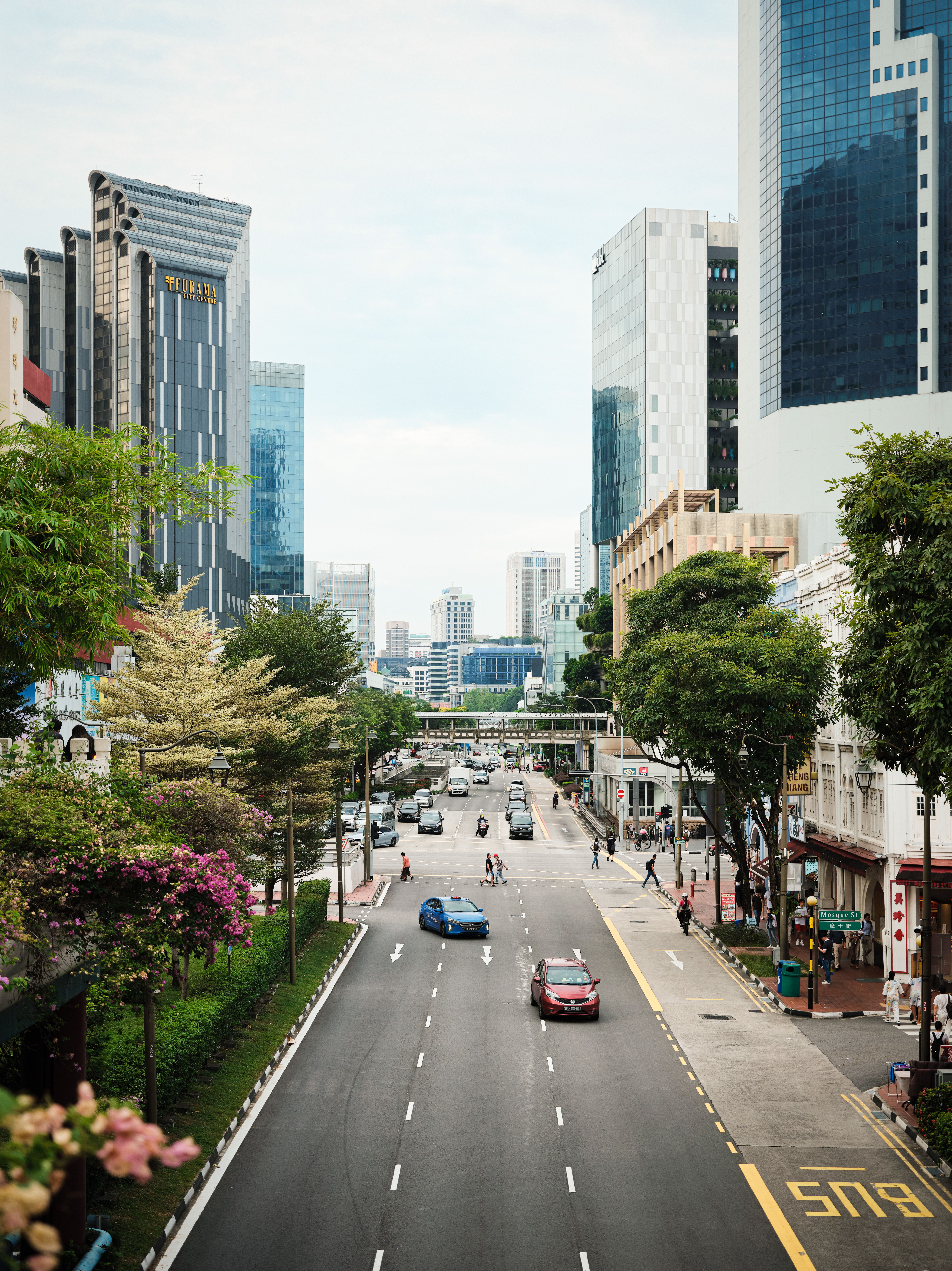 Urban Street Scene with Skyscrapers and Traffic · Free Stock Photo