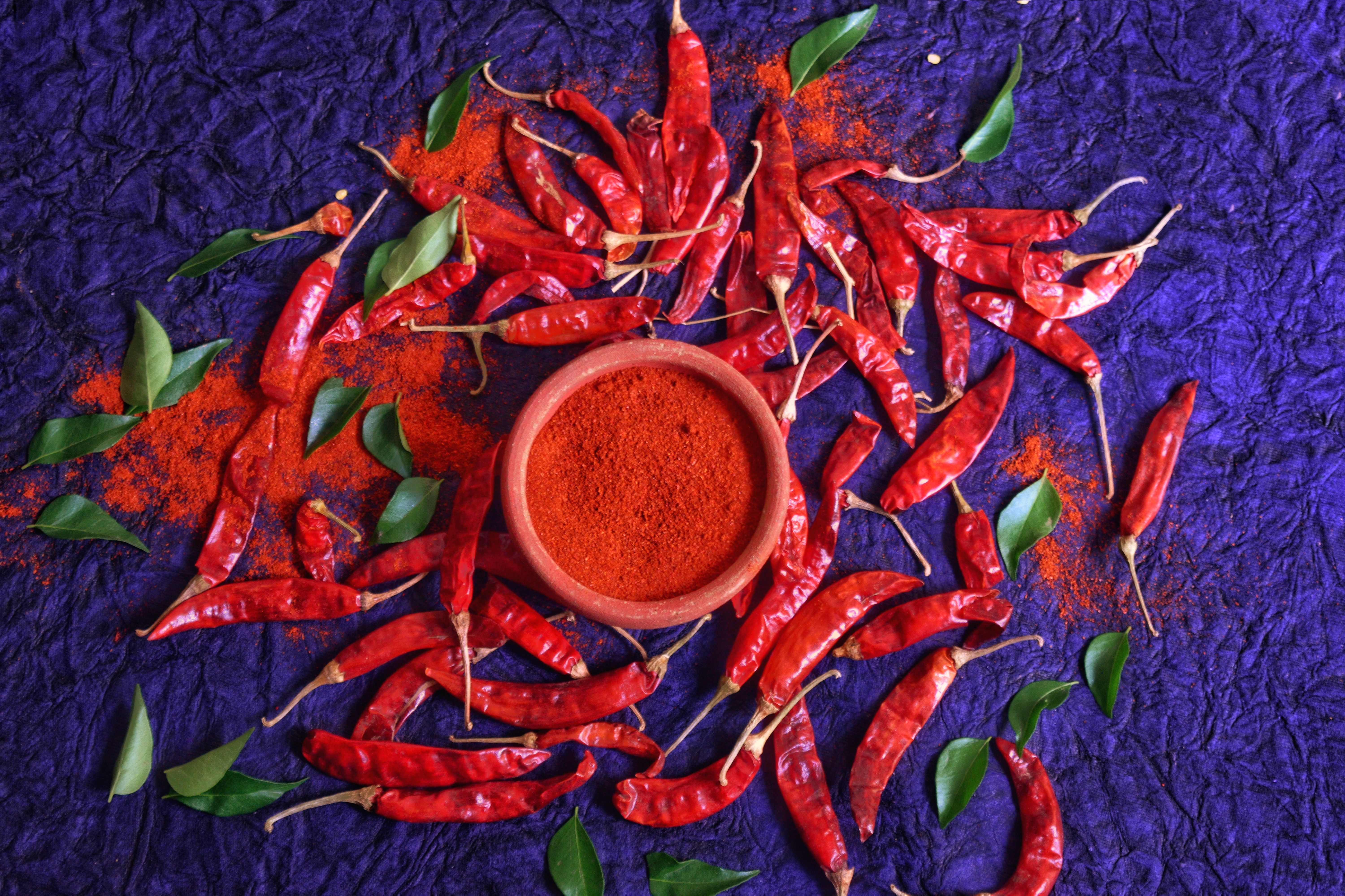 Jar of homemade vegetable seasoning powder with dried herbs and spices