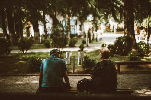 Free Senior couple enjoying a peaceful moment in a park in Kutaisi, Georgia. Stock Photo