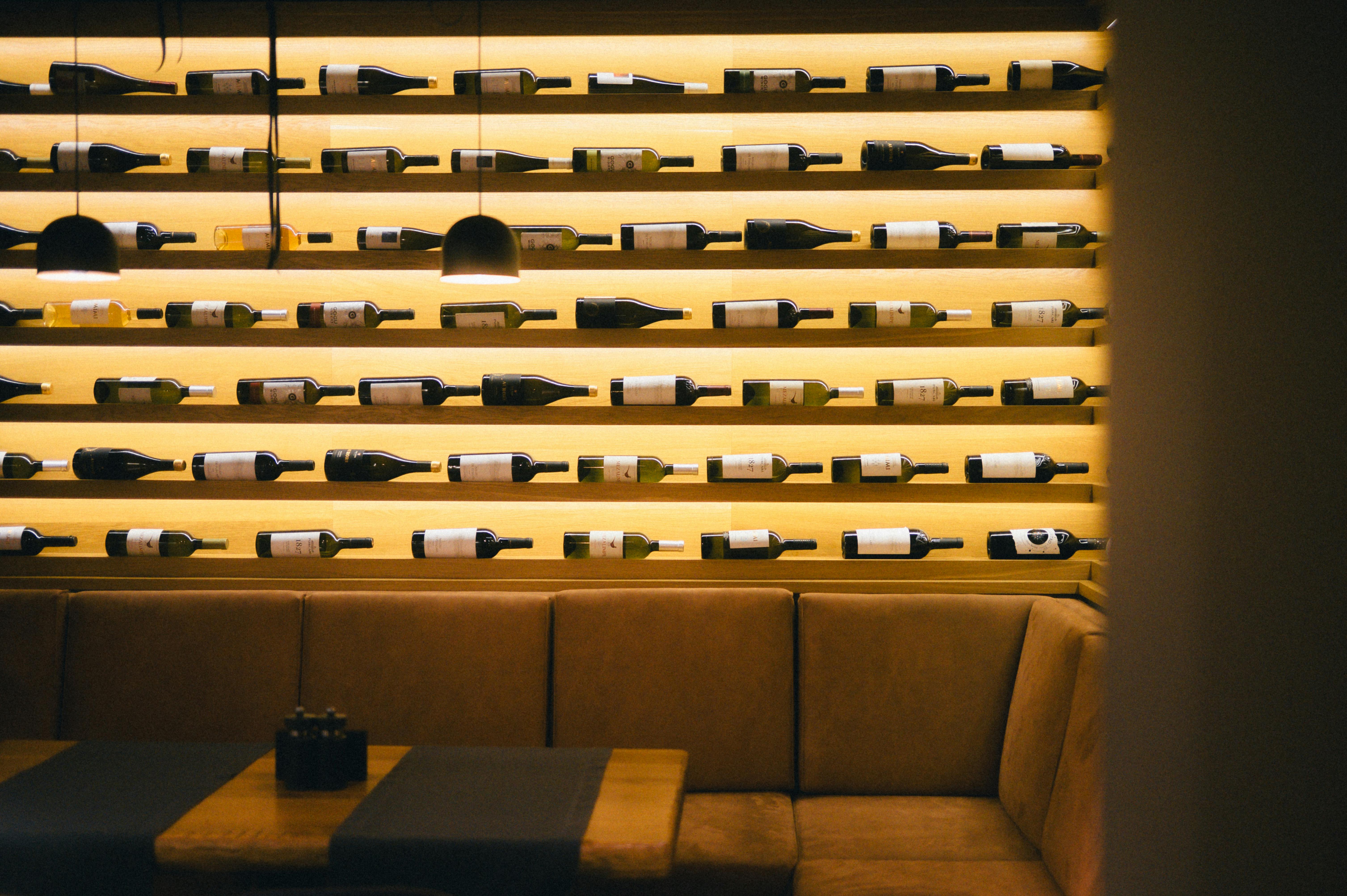 Modern glass wine wall with backlighting