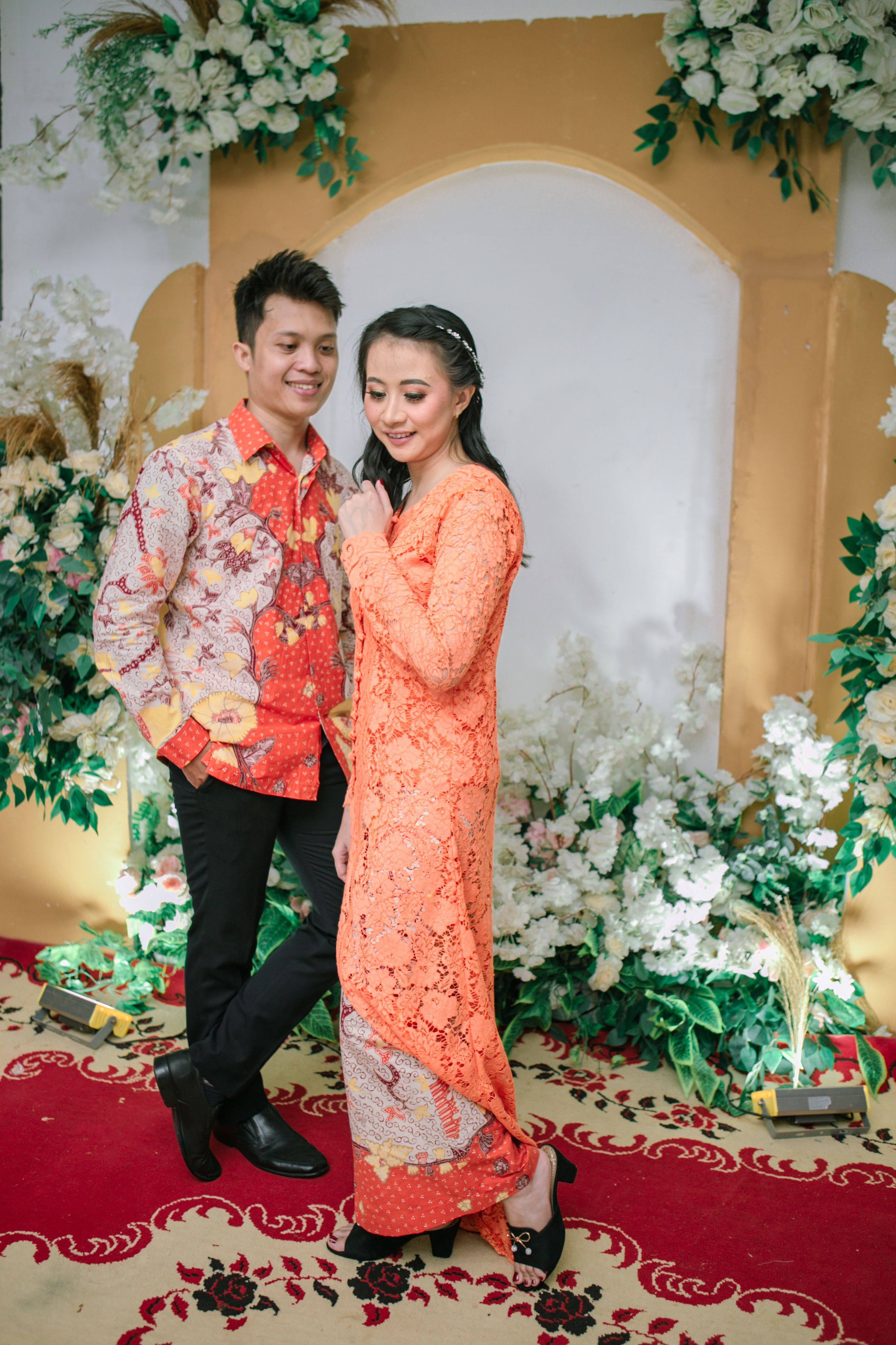 Traditional Couple Portrait in Vibrant Attire · Free Stock Photo