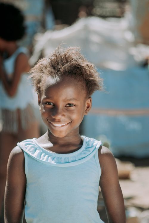 Free Happy child smiling in a bright, outdoor scene in Winburg, South Africa, conveying joy and warmth. Stock Photo