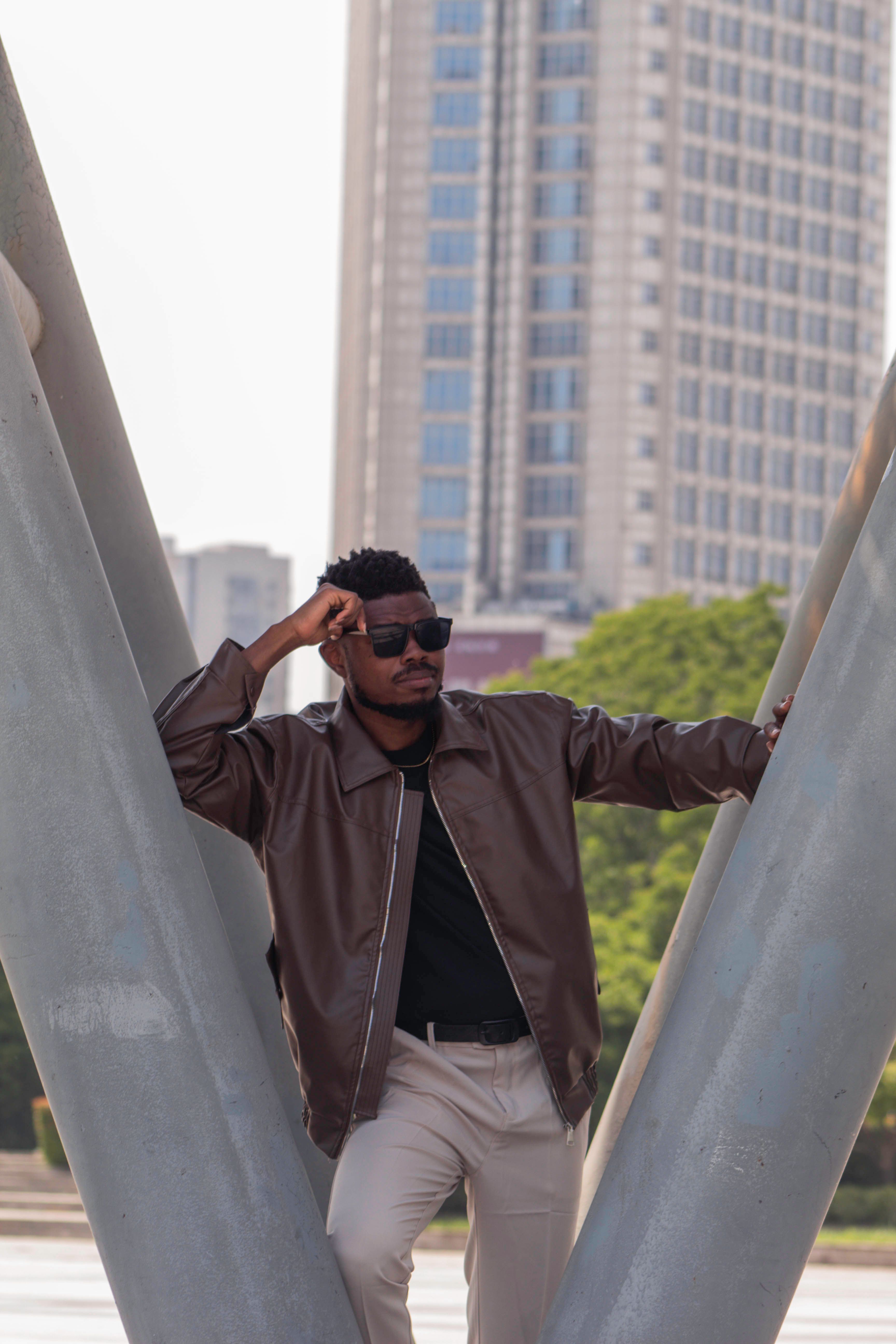 Stylish Man Posing by Urban Architecture · Free Stock Photo