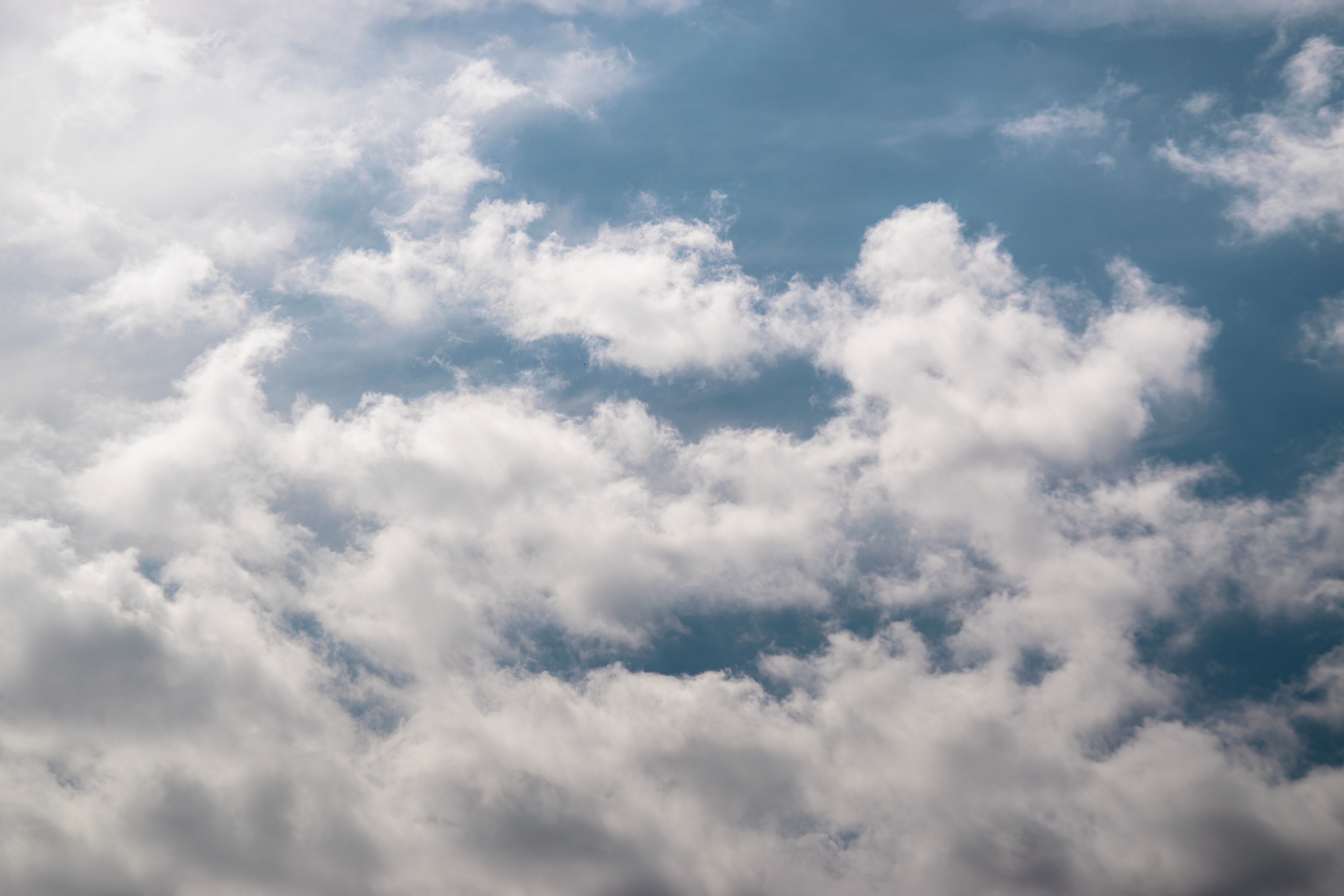 Serene Blue Sky with Fluffy White Clouds · Free Stock Photo
