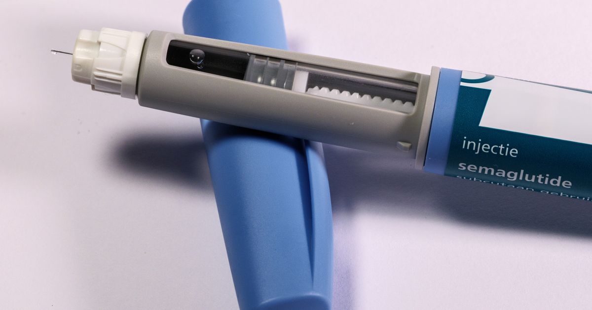A semaglutide injection pen on a plain background