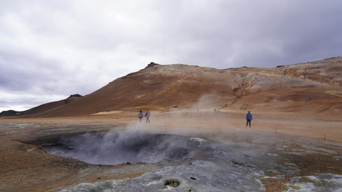 Free Explore the awe-inspiring geothermal landscape of Iceland with visible steam and rugged terrain. Stock Photo
