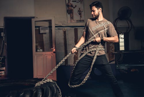 Free Man Pulling Rope Tied on a Tire Stock Photo
