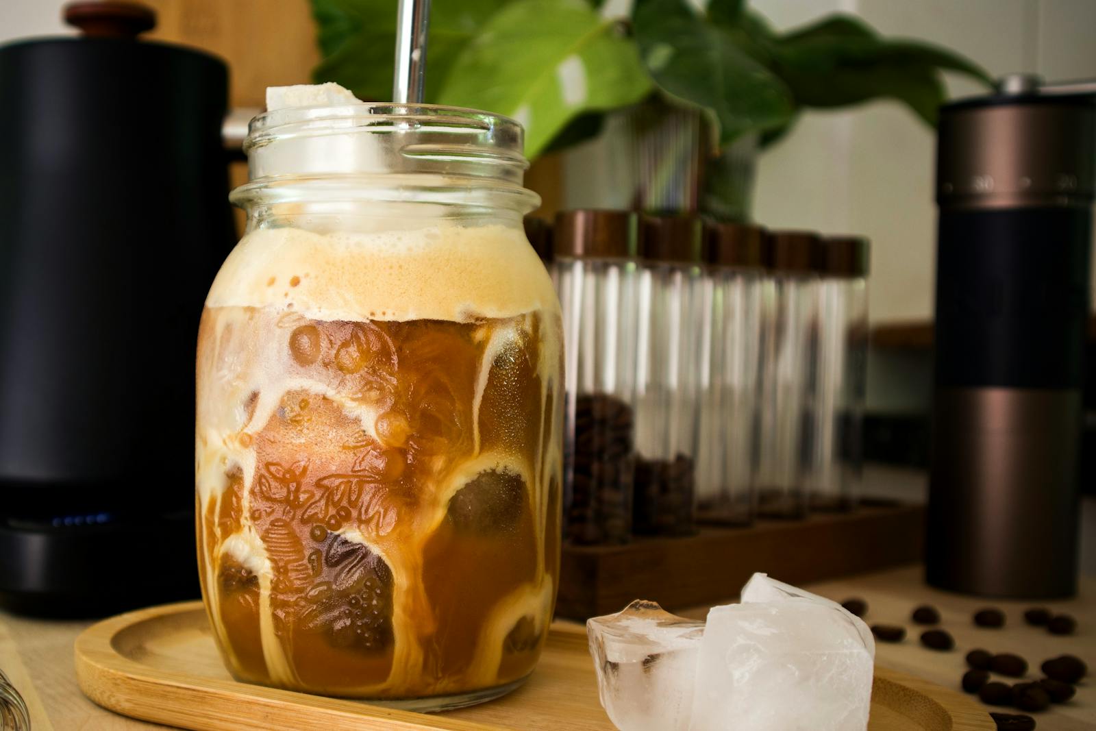 Mason jar cold brew coffee over ice on counter