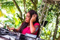 Female Dj Playing Mixing Console