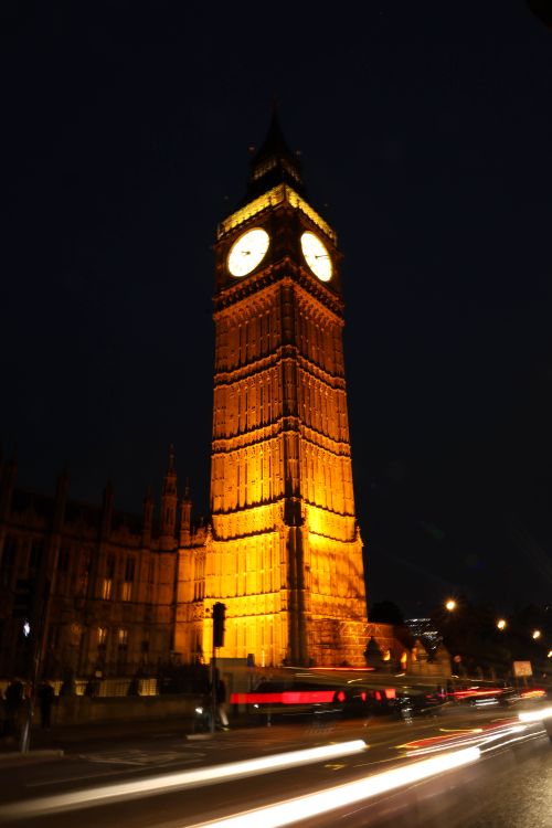 Free Night view of Big Ben with lights and traffic trails in London, UK. Stock Photo