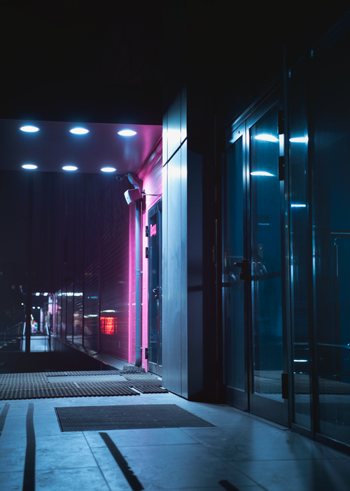 Free Stylish entrance in Moscow, Russia illuminated by vibrant neon lights at night. Stock Photo