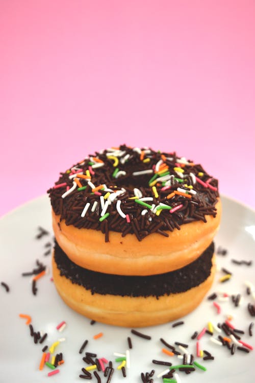 Free Close-up Photo of Stacked Doughnut with Sprinkles Stock Photo