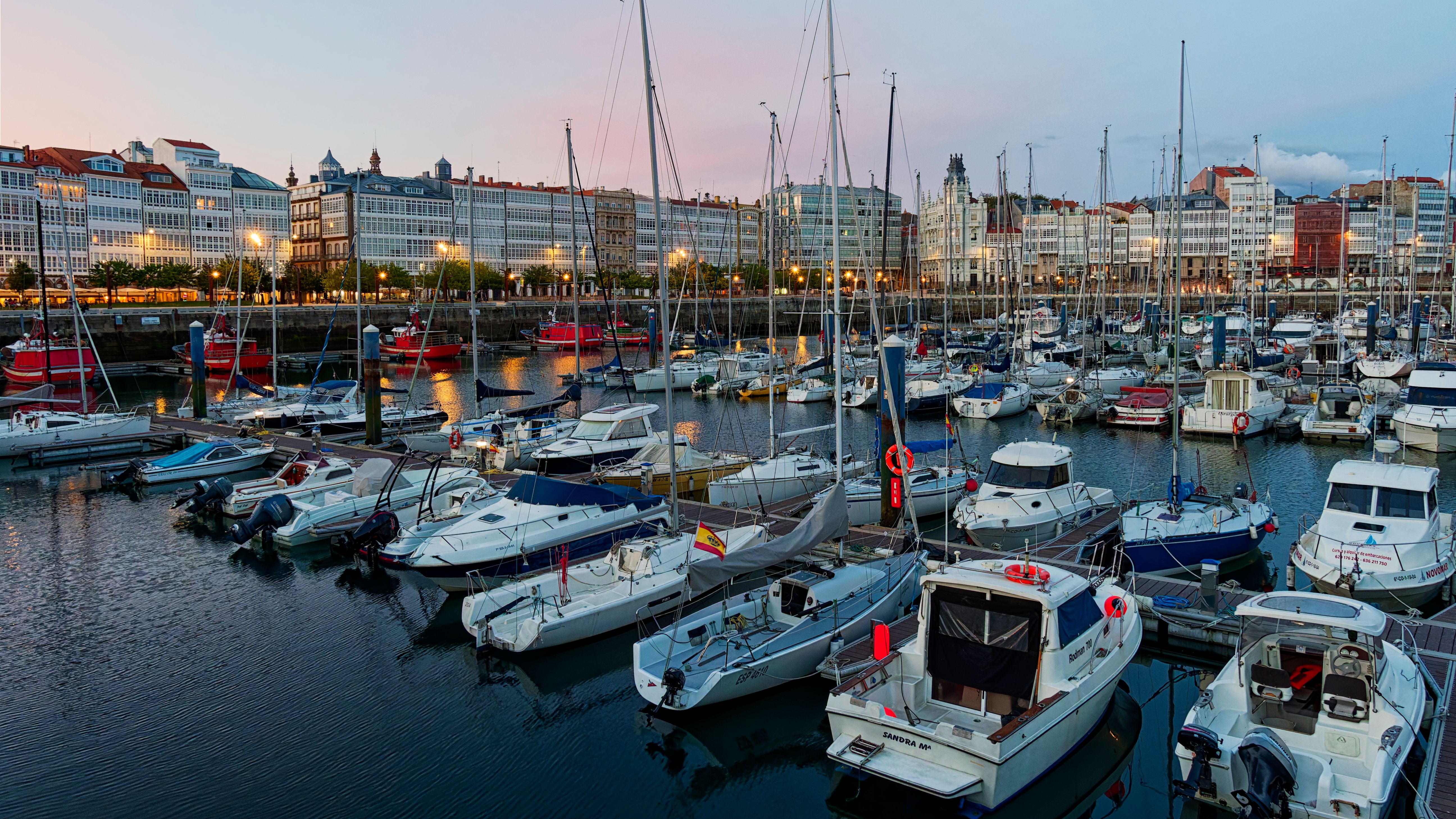 Outstanding Ferrari Car Driving & Sailing Experience Barcelona Review: The Ultimate Land-and-Sea Adventure Review 2026 - Scenic view of a marina filled with boats in La Coruna at sunset.