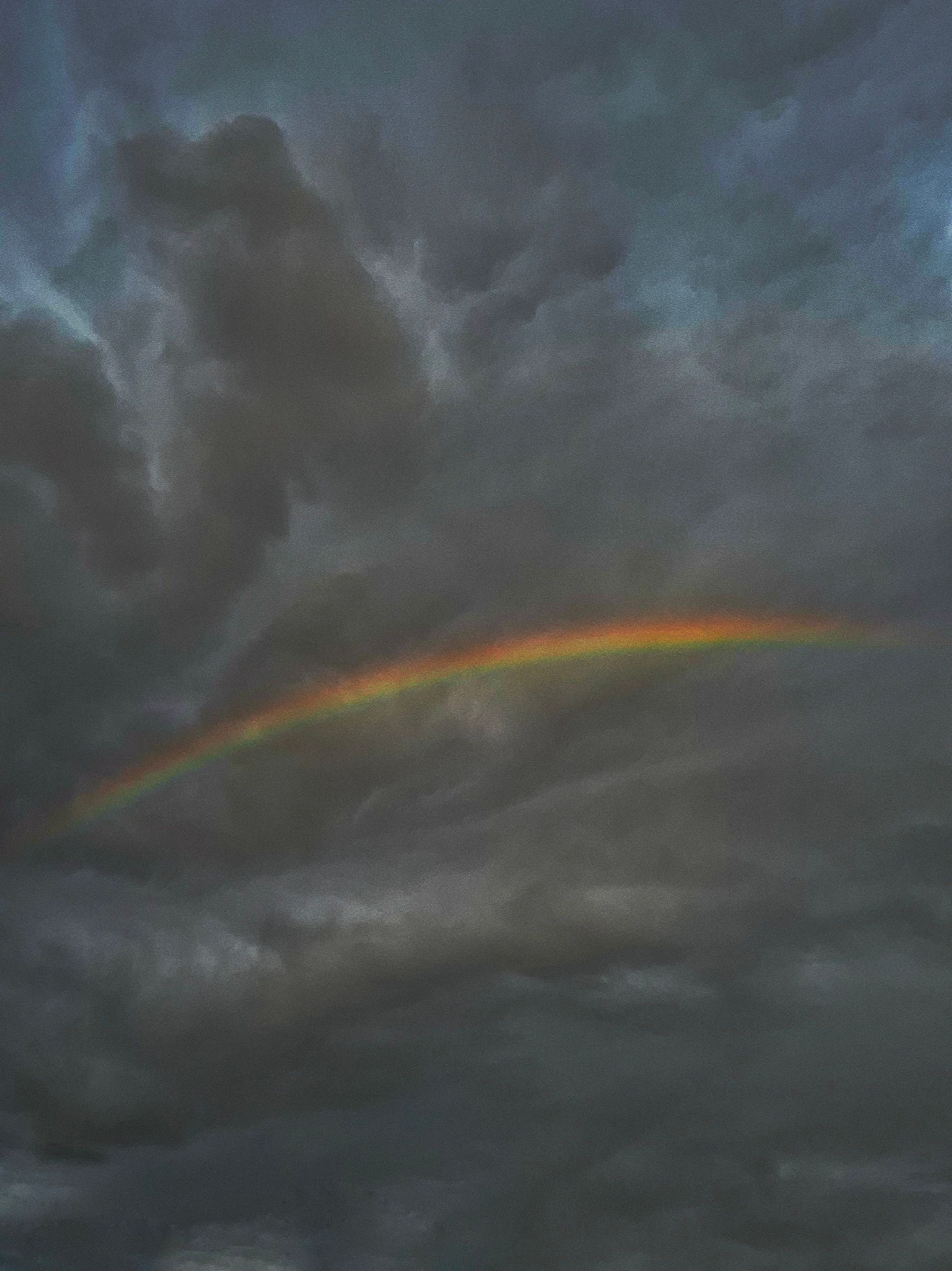 Dark Stormy Sky with a Rainbow Arc · Free Stock Photo