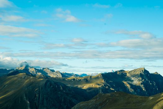 Breathtaking view of alpine mountains with clear blue sky, capturing nature's beauty in daylight.