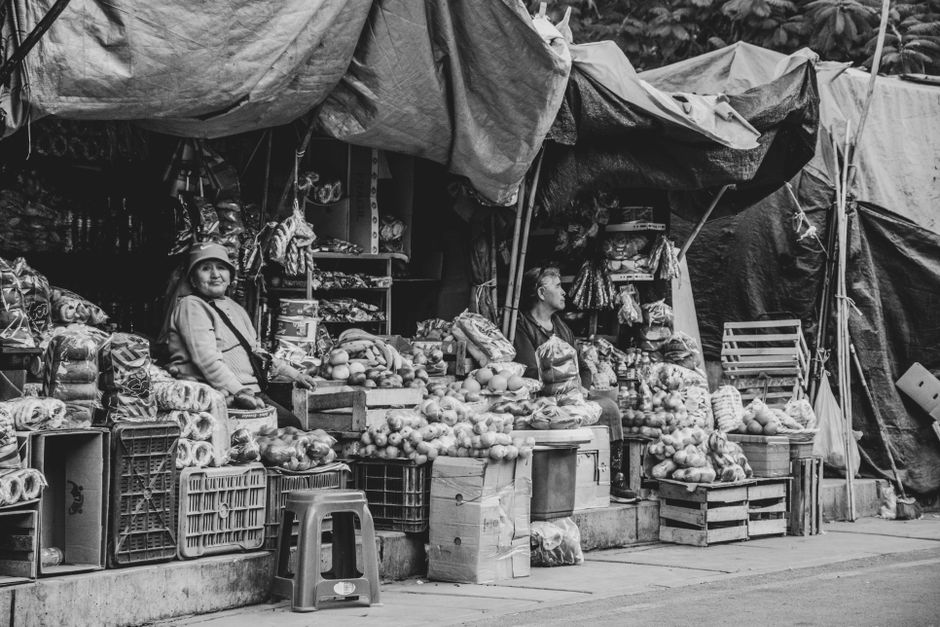 Vibrant outdoor market stall with fresh produce and local vendors in São Paulo