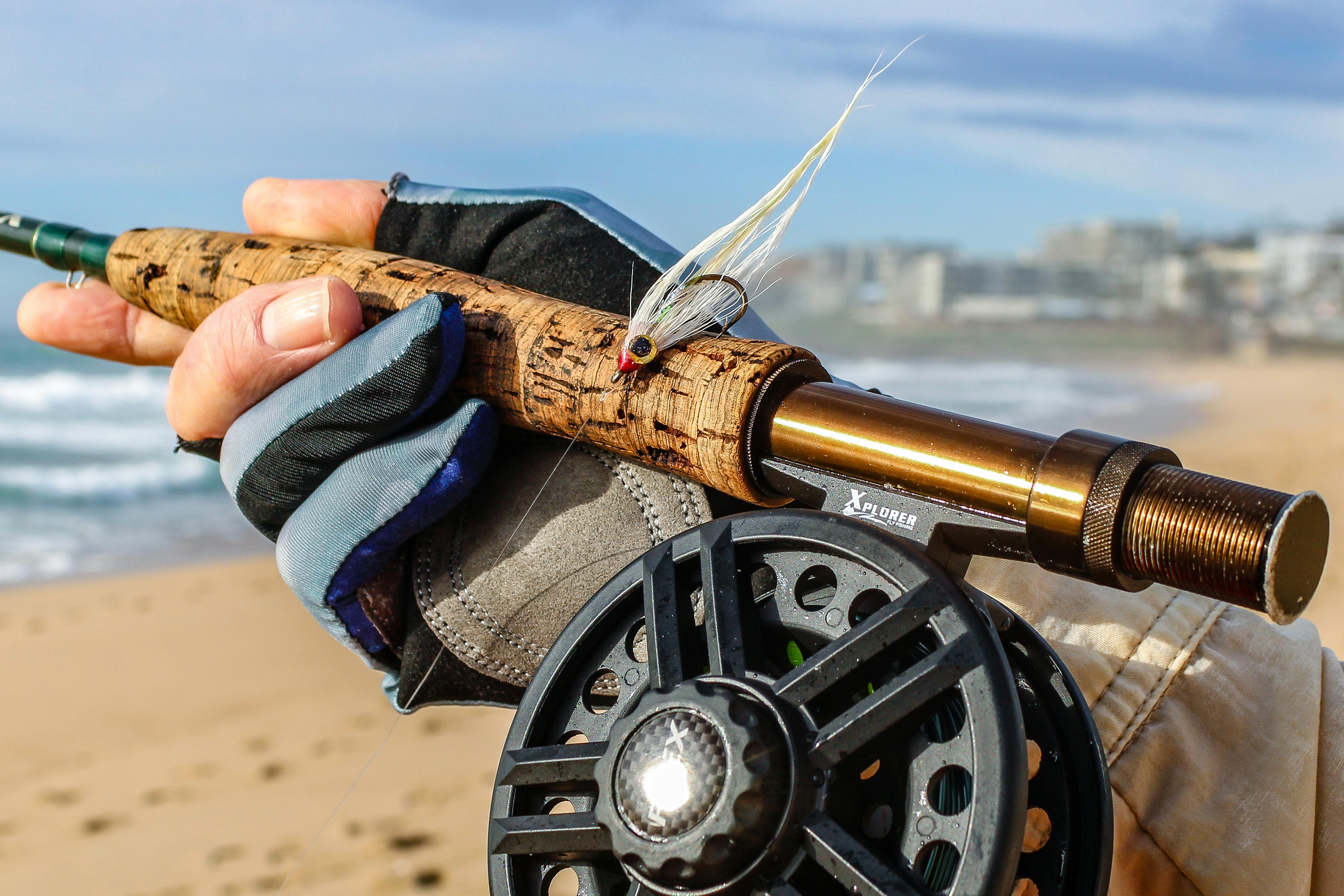 Close-up of fly fishing rod and reel on Margate Beach, perfect for anglers.