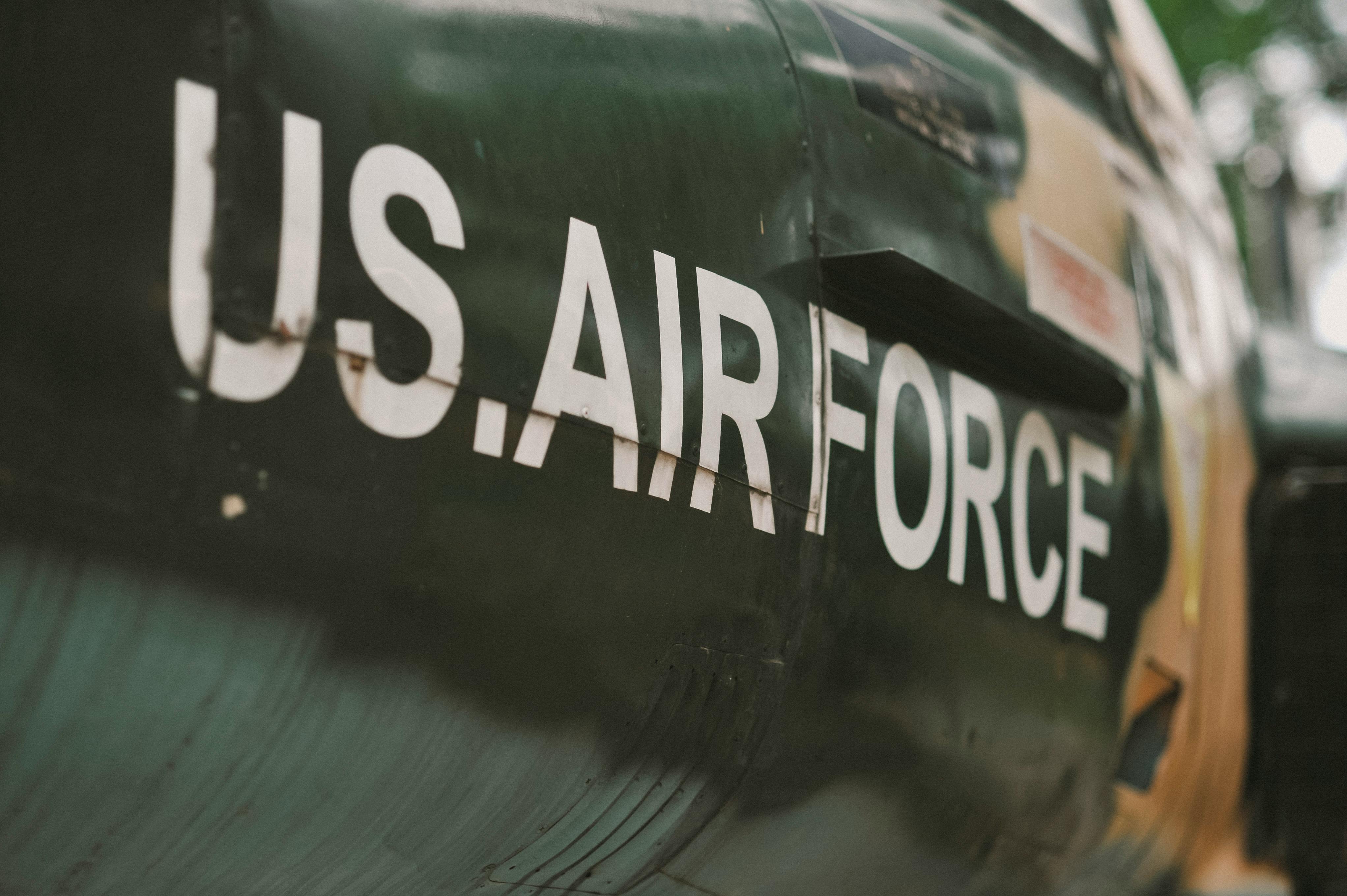 Detailed view of a rusted U.S. Air Force aircraft, highlighting the worn surface.