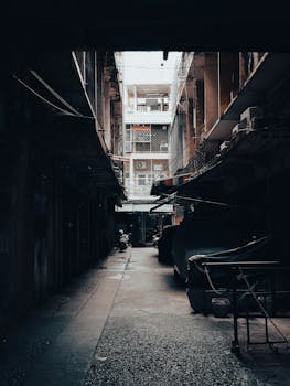 Explore a mysterious alleyway in Bangkok's bustling Chinatown, exuding a vintage vibe.