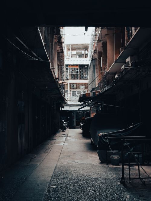 Free Explore a mysterious alleyway in Bangkok's bustling Chinatown, exuding a vintage vibe. Stock Photo