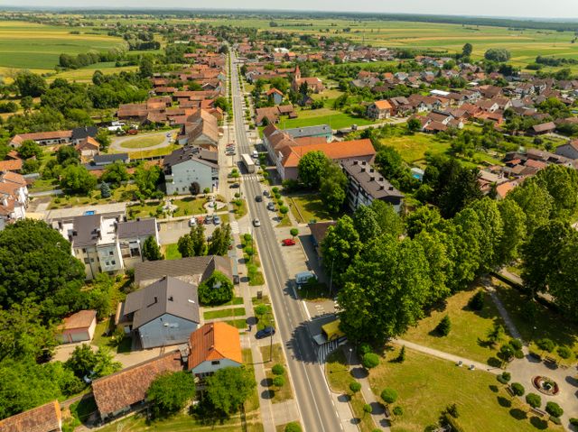 Small town main road from above — photo by Vladimir Srajber on Pexels