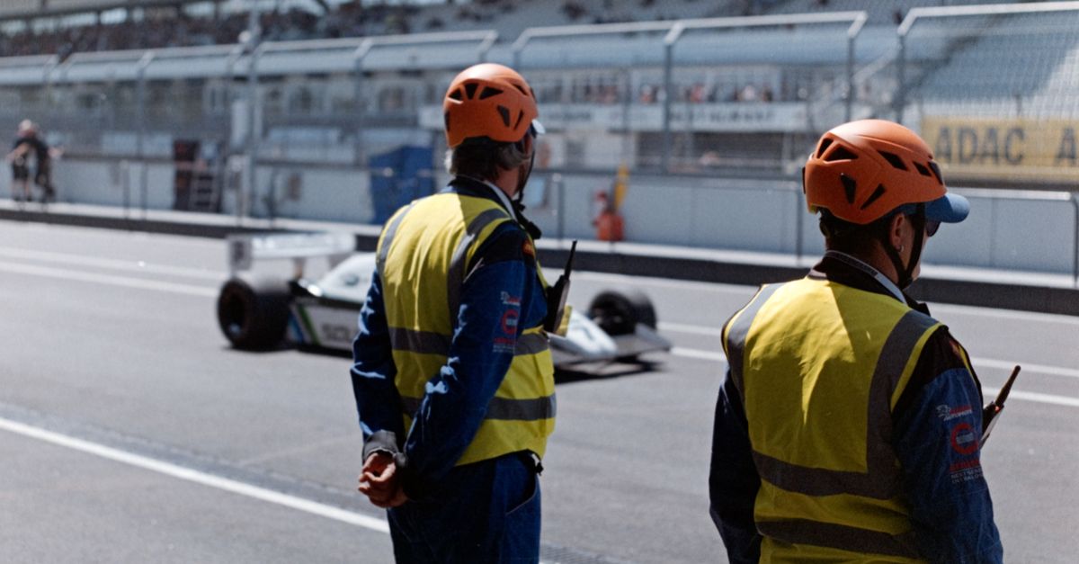 Track Racing Officials Race Officials Overseeing Car on Track · Free Stock Photo