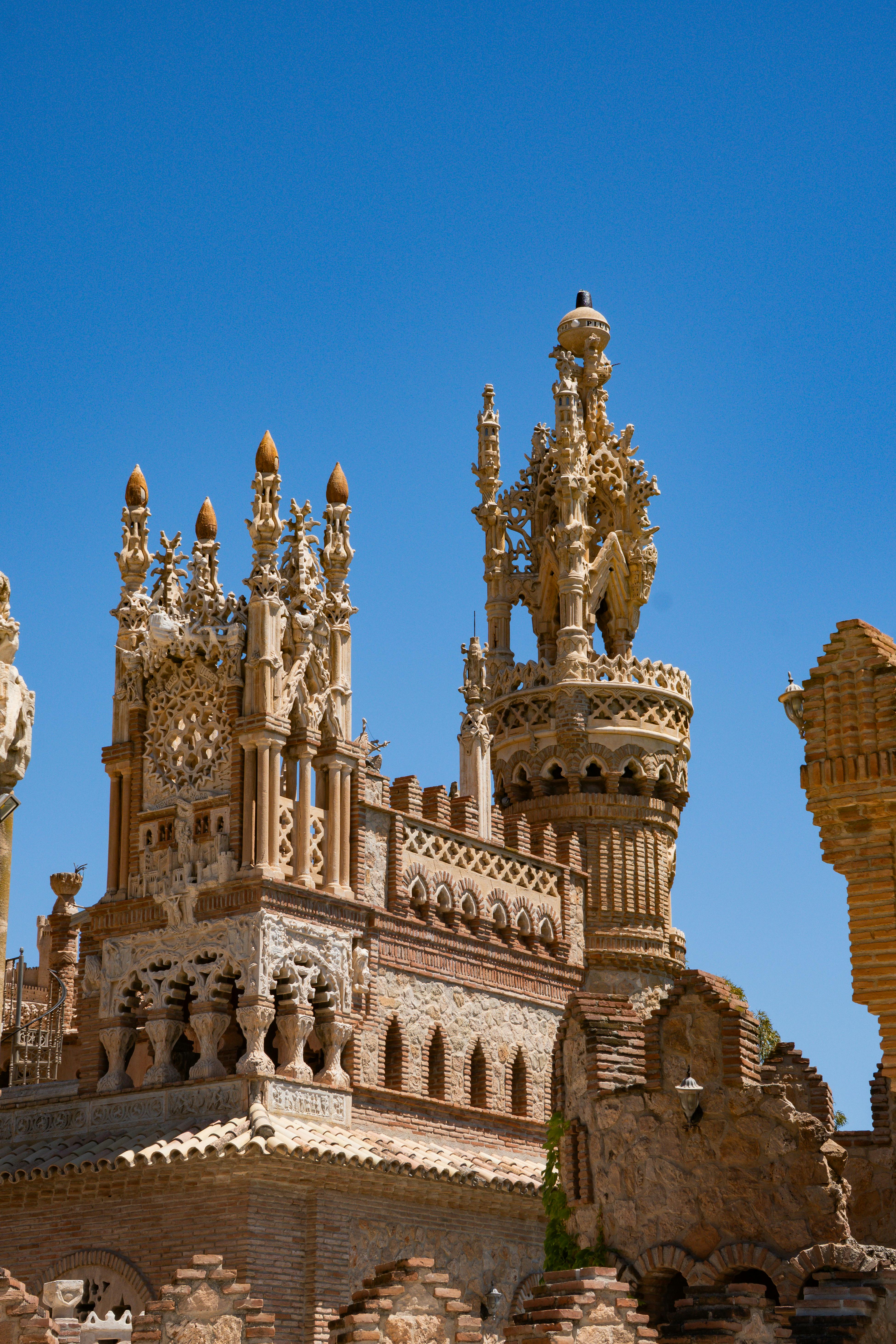 Stunning view of Castillo de Colomares under clear blue skies in Benalmádena, Spain.