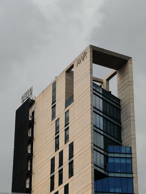 Free Striking brutalist building exterior with concrete and glass facade. Stock Photo