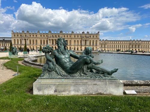 Free Historic sculpture in the gardens of the Palace of Versailles, Paris, showcasing French architecture. Stock Photo