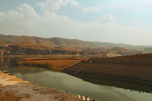 Beautiful panoramic view overlooking the landscape and water in Hasankeyf under a clear sky.