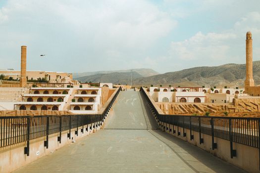 Capture of Hasankeyf's ancient architecture with a scenic backdrop, showcasing historical charm.